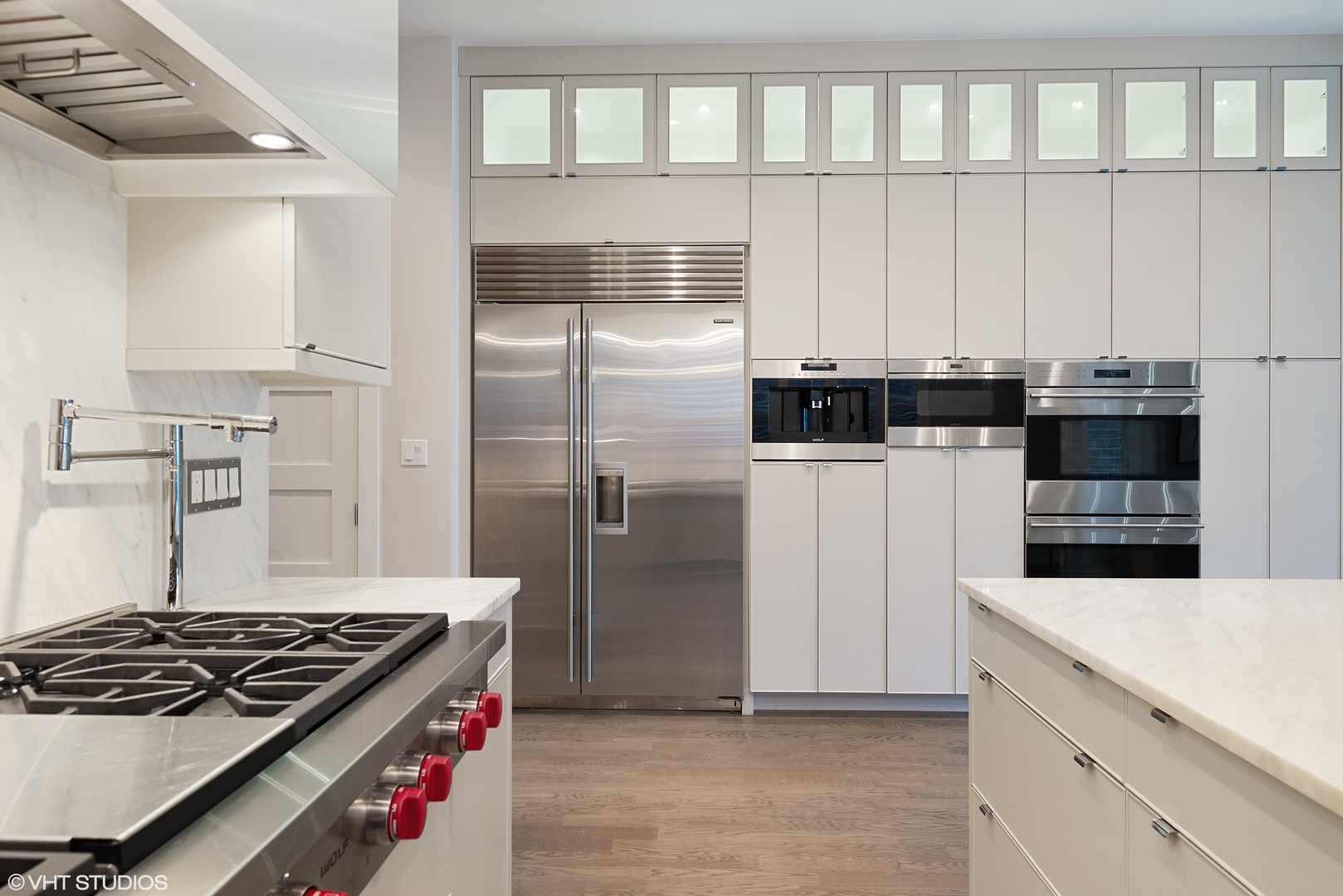 1428 West Wolfram Street Chicago, IL 60657 - Photo 12 of 47 a kitchen with stainless steel appliances kitchen island granite countertop a refrigerator and a stove