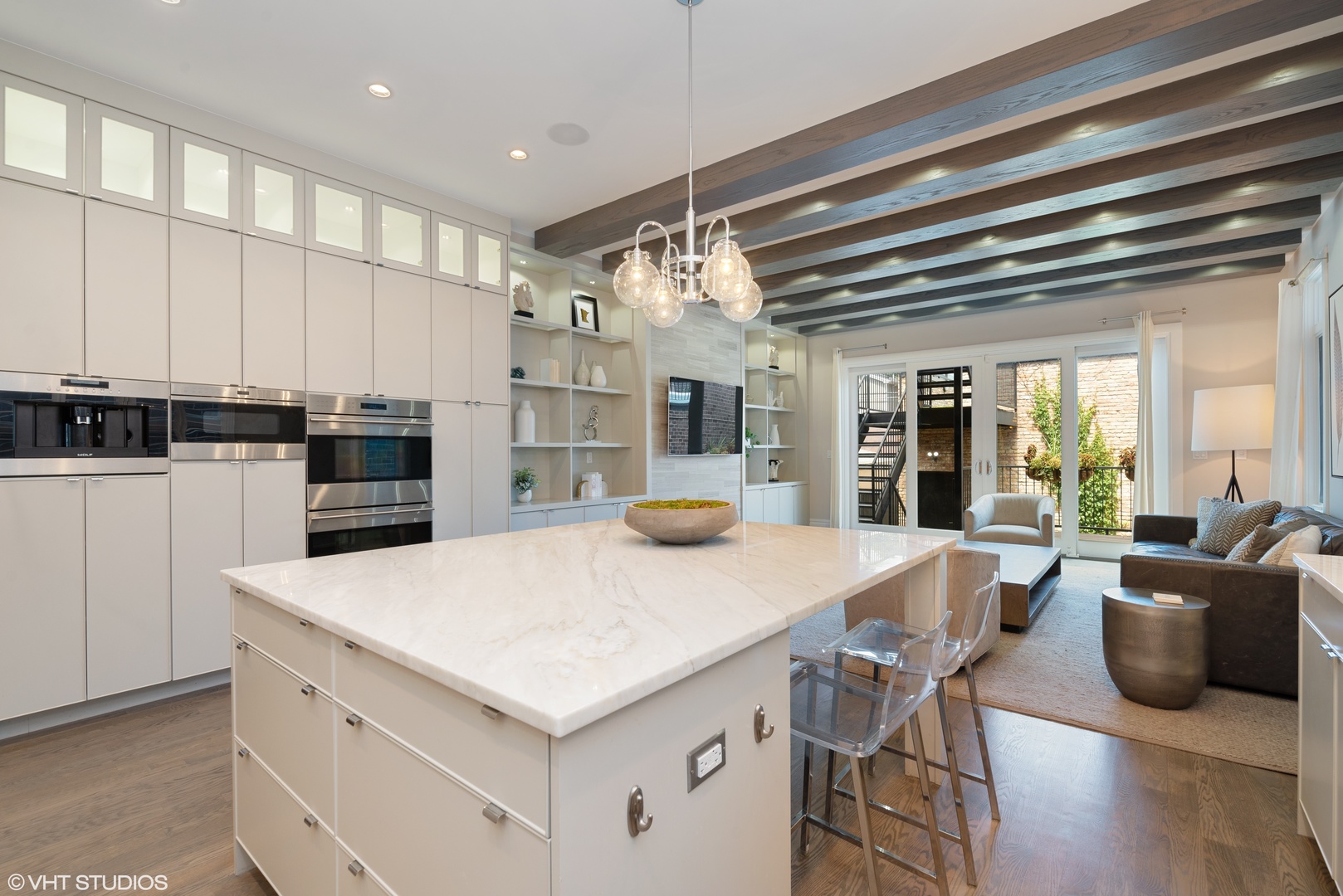 1428 West Wolfram Street Chicago, IL 60657 - Photo 13 of 47 an open kitchen with granite countertop a stove and white cabinets