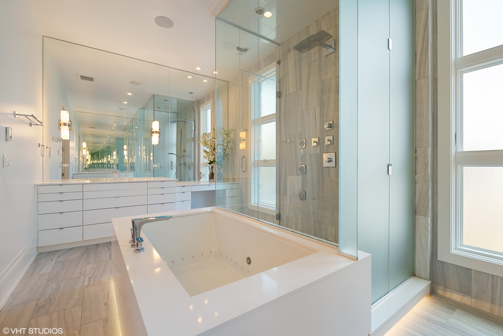 1428 West Wolfram Street Chicago, IL 60657 - Photo 23 of 47 a bathroom with a tub a sink and a large mirror