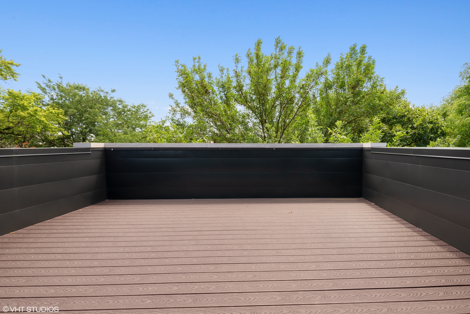1428 West Wolfram Street Chicago, IL 60657 - Photo 41 of 47 a view of balcony with wooden floor and fence