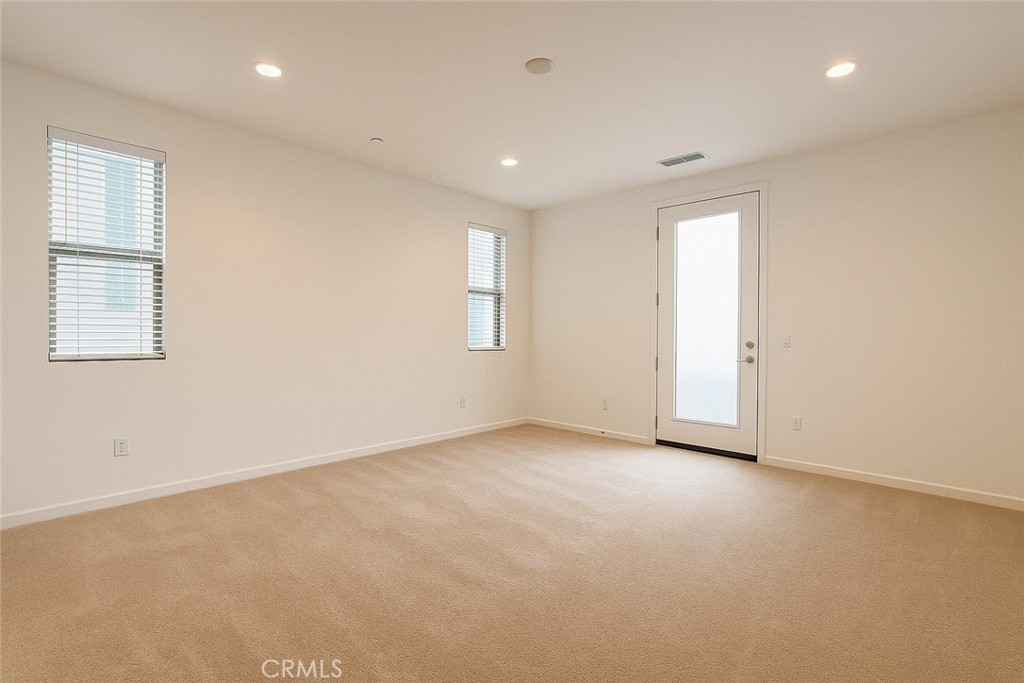 566 Boulder Circle Claremont, CA 91711 - Photo 3 of 12 an empty room with windows