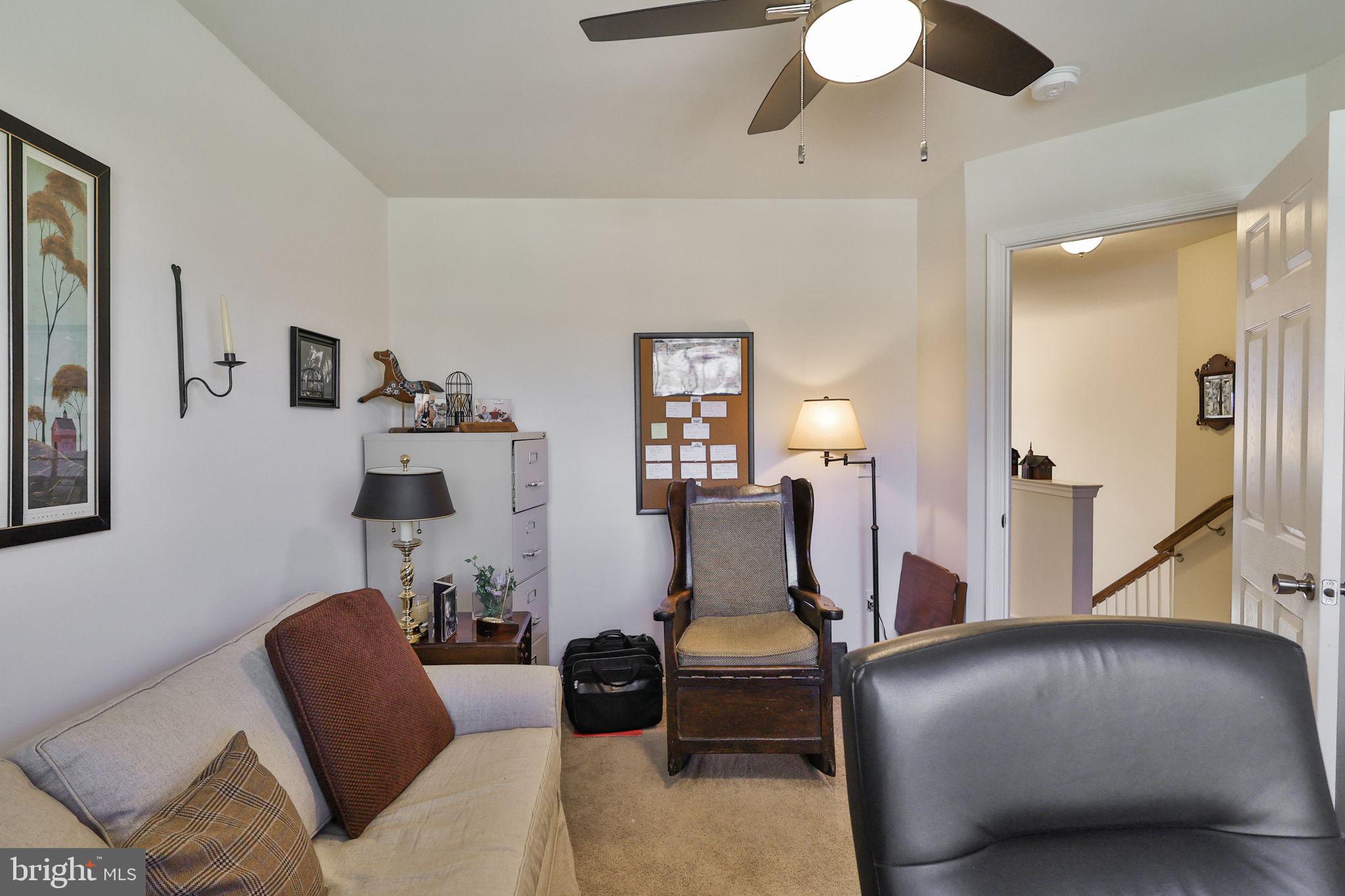 3872 Mink Road Emmaus, PA 18049 - Photo 29 of 39 a living room with furniture and a chandelier