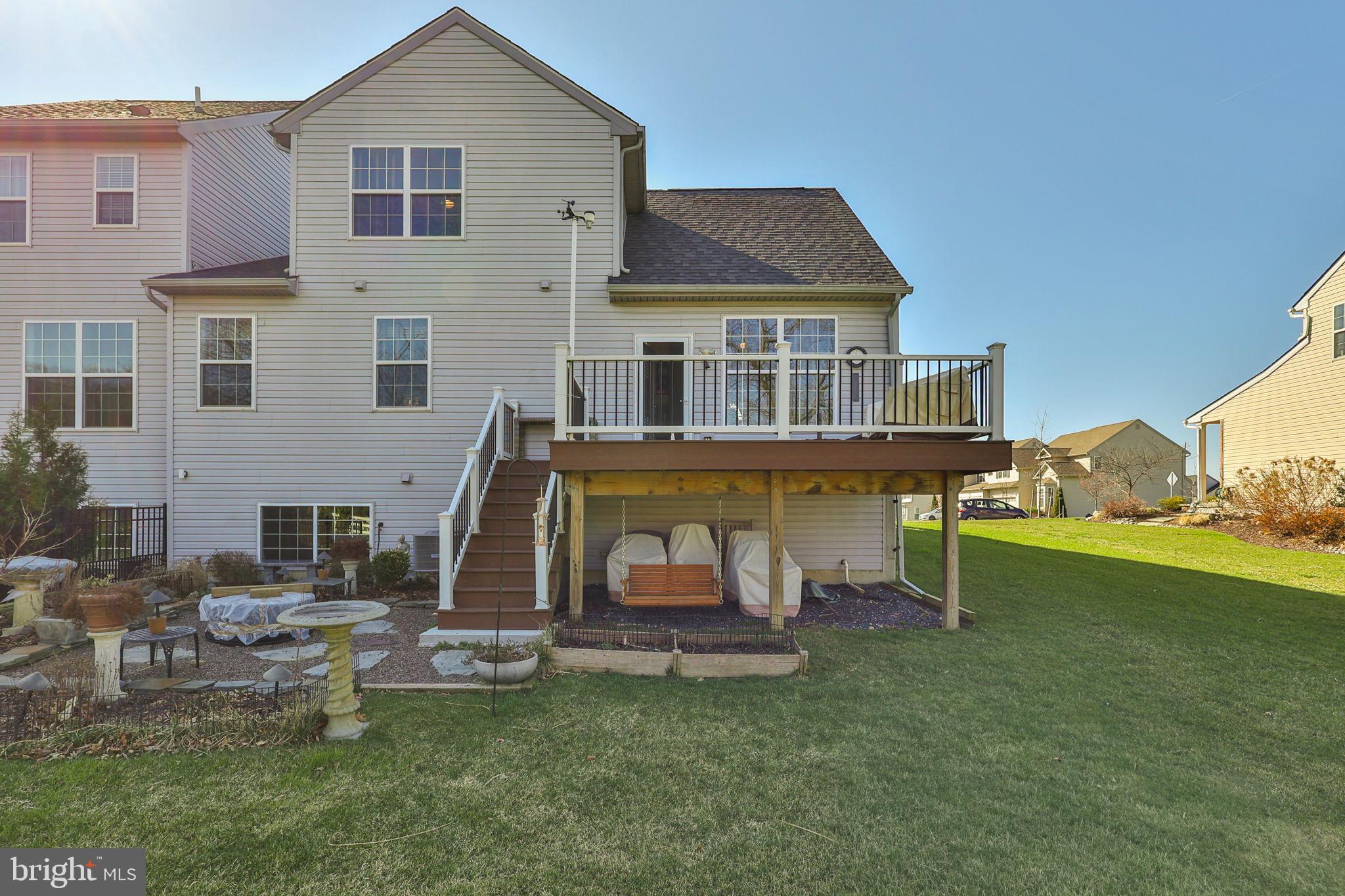 3872 Mink Road Emmaus, PA 18049 - Photo 38 of 39 a view of a house with a yard porch and sitting area