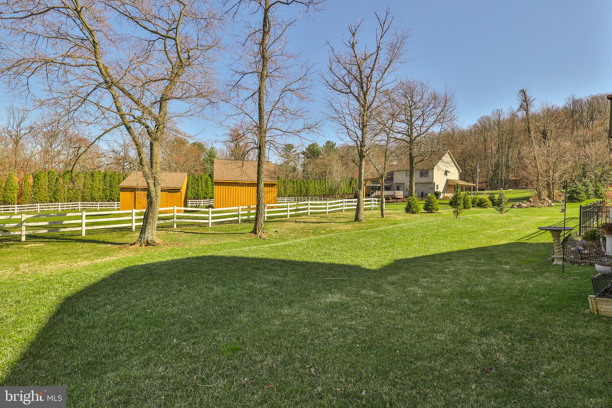 3872 Mink Road Emmaus, PA 18049 - Photo 39 of 39 a view of grassy field with benches and trees