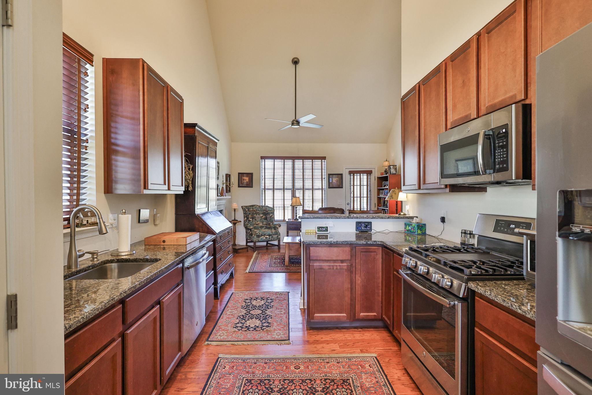 3872 Mink Road Emmaus, PA 18049 - Photo 6 of 39 a large kitchen with stainless steel appliances granite countertop a stove a sink dishwasher a microwave oven with granite countertops and cabinets