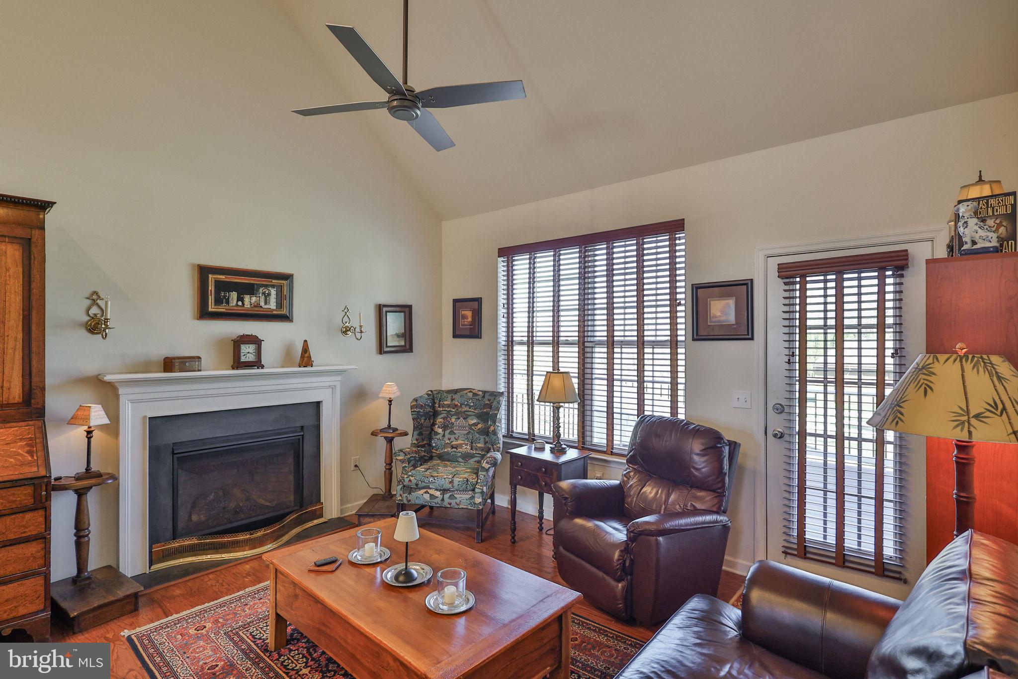 3872 Mink Road Emmaus, PA 18049 - Photo 10 of 39 a living room with furniture a flat screen tv and a fireplace
