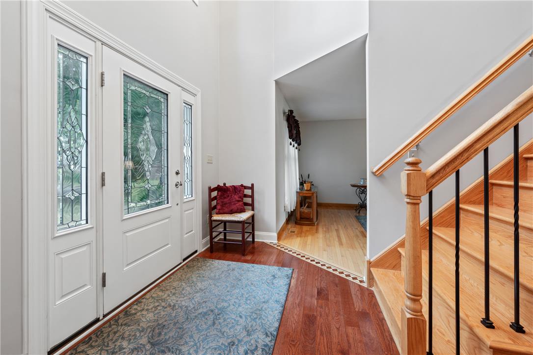 4568 Greenfield Road Bethlehem, PA 18017 - Photo 6 of 59 A grand entry with a leaded glass door and gleaming hardwood floors leads to a sun-filled interior.