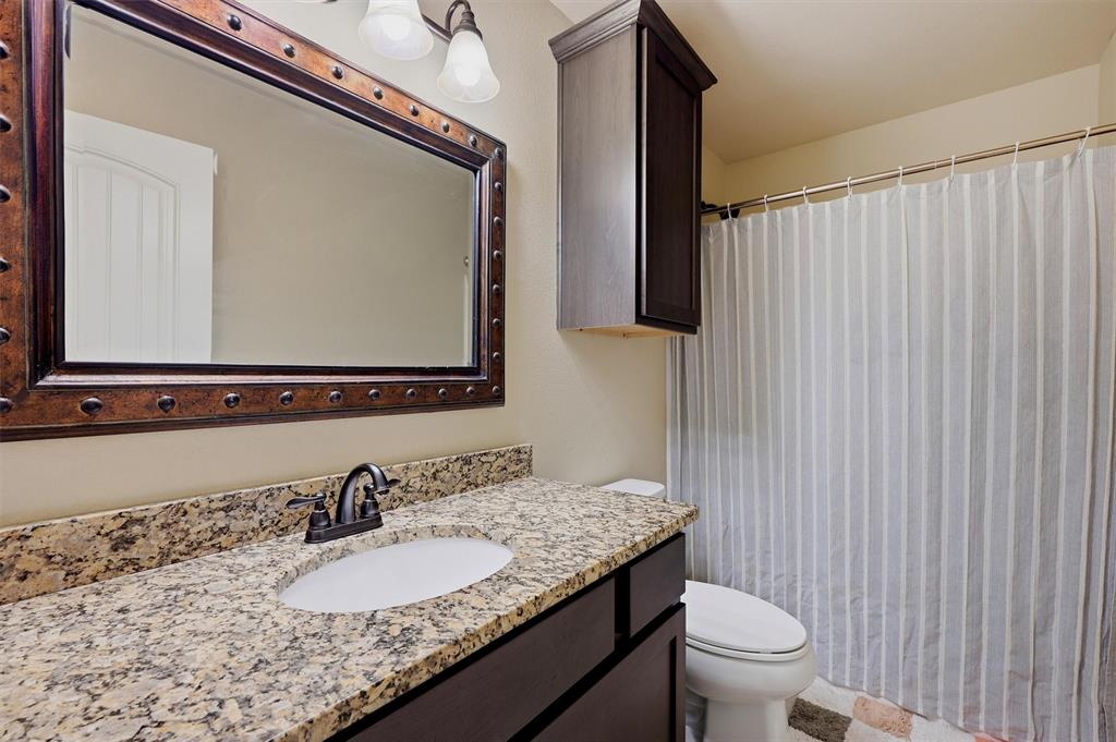 3020 West Loy Lake Road Denison, TX 75020 - Photo 21 of 32 Second full bathroom and yes this one is smaller but it's a shower/tub combo!