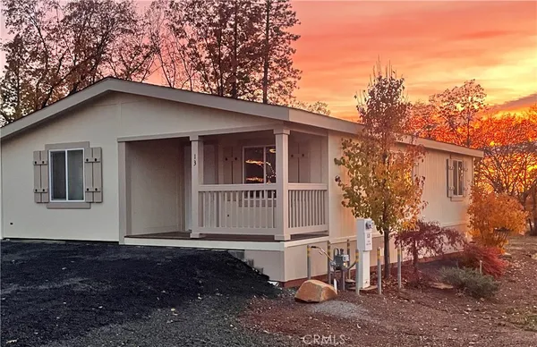 a house with trees in the background