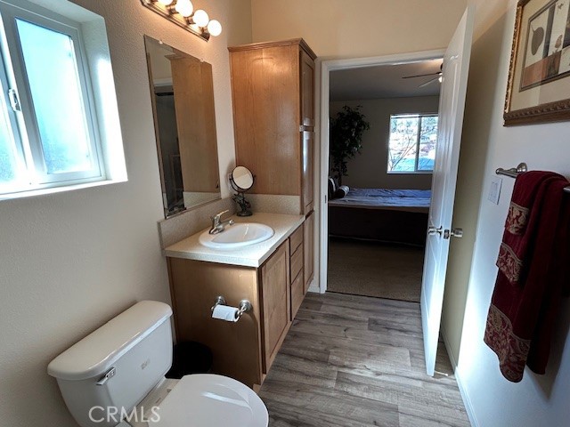 1340 Bille Road, Unit 13 Paradise, CA 95969 - Photo 19 of 31 a bathroom with a toilet sink and mirror