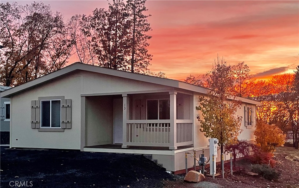 1340 Bille Road, Unit 13 Paradise, CA 95969 - Photo 2 of 31 a house with trees in the background
