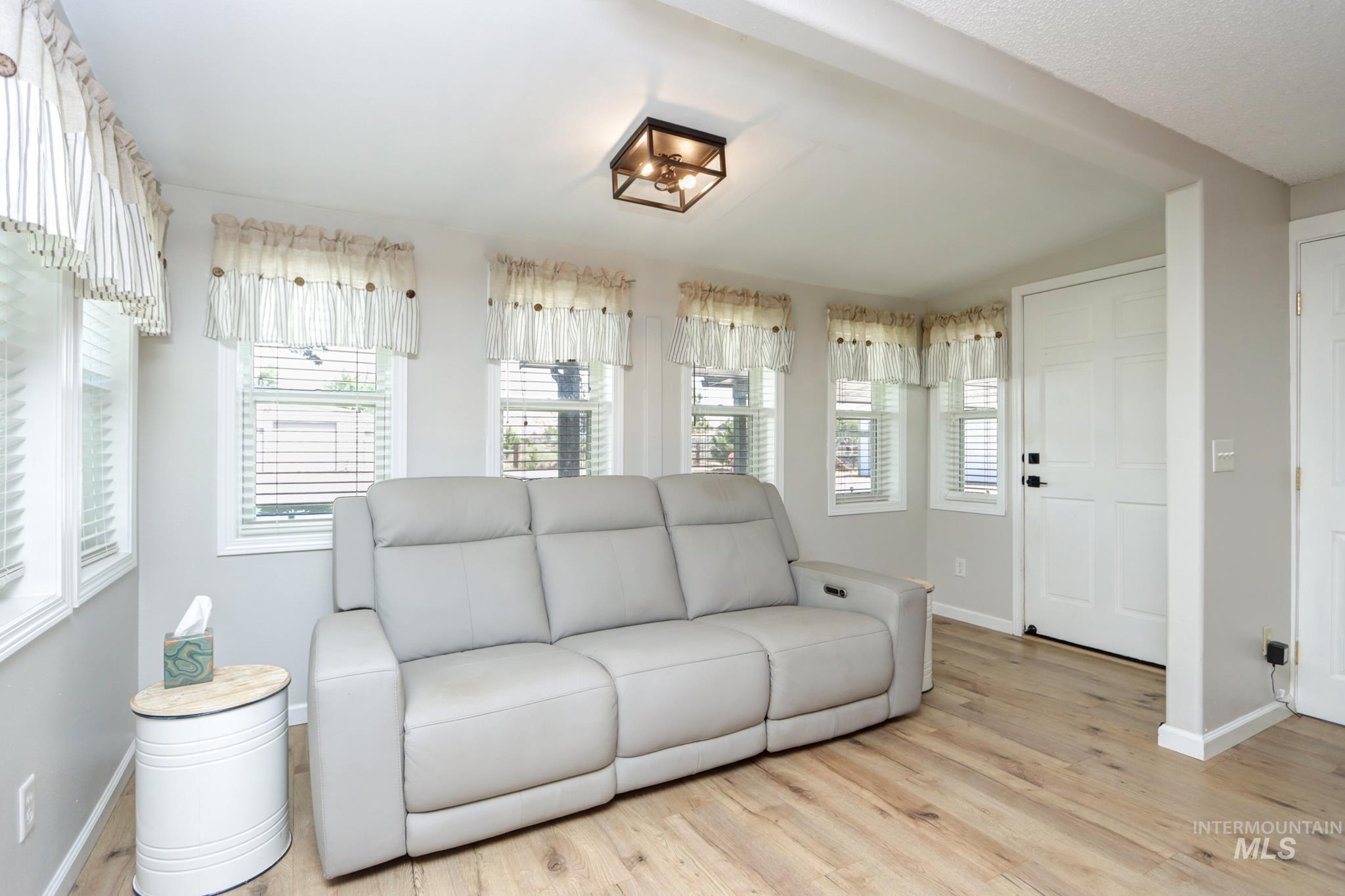 2528 Waterwheel Road Emmett, ID 83617 - Photo 25 of 50 Bedroom featuring light gray walls, wood-finish flooring, and a ceiling fan with integrated lighting