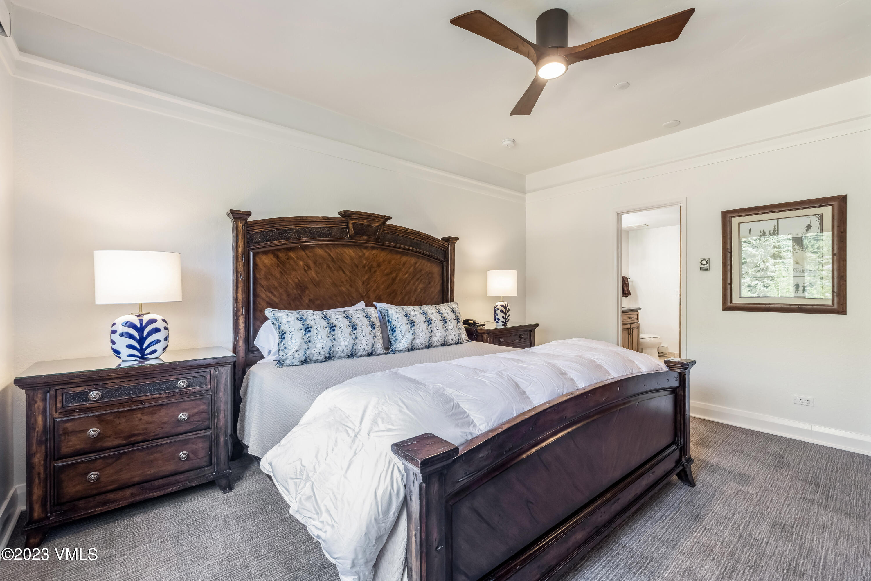 120 Offerson Road, Unit D260 Beaver Creek, CO 81620 - Photo 15 of 41 a bed room with a bed and a lamp on a dresser
