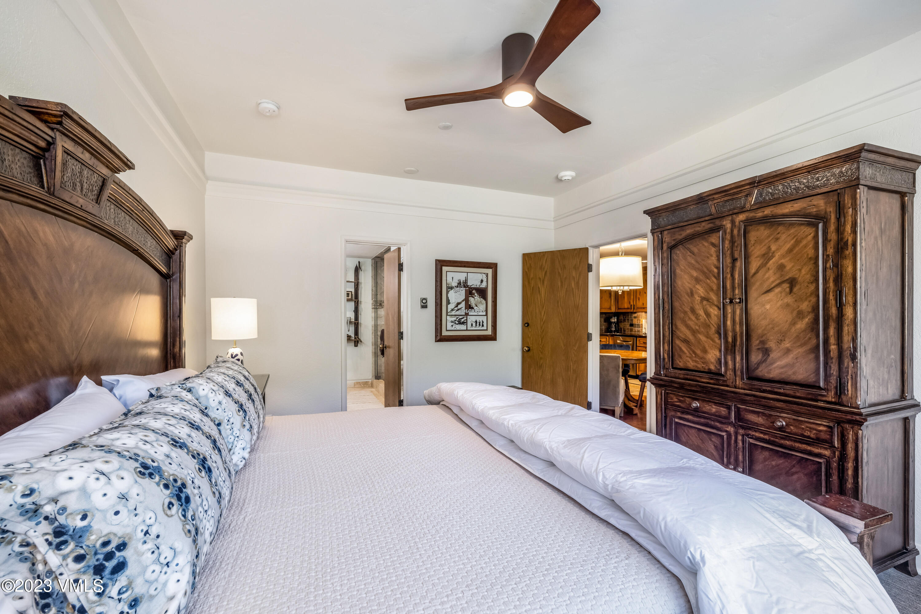 120 Offerson Road, Unit D260 Beaver Creek, CO 81620 - Photo 16 of 41 a bedroom with a bed and a flat screen tv
