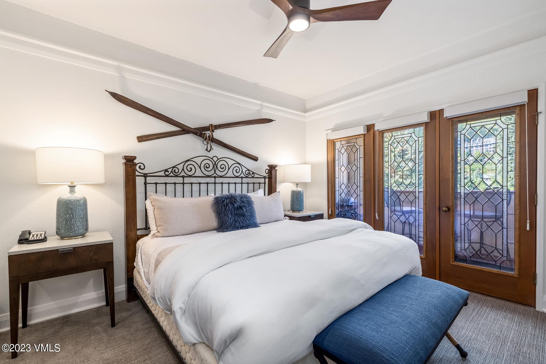 120 Offerson Road, Unit D260 Beaver Creek, CO 81620 - Photo 18 of 41 a bedroom with a large bed and a chandelier