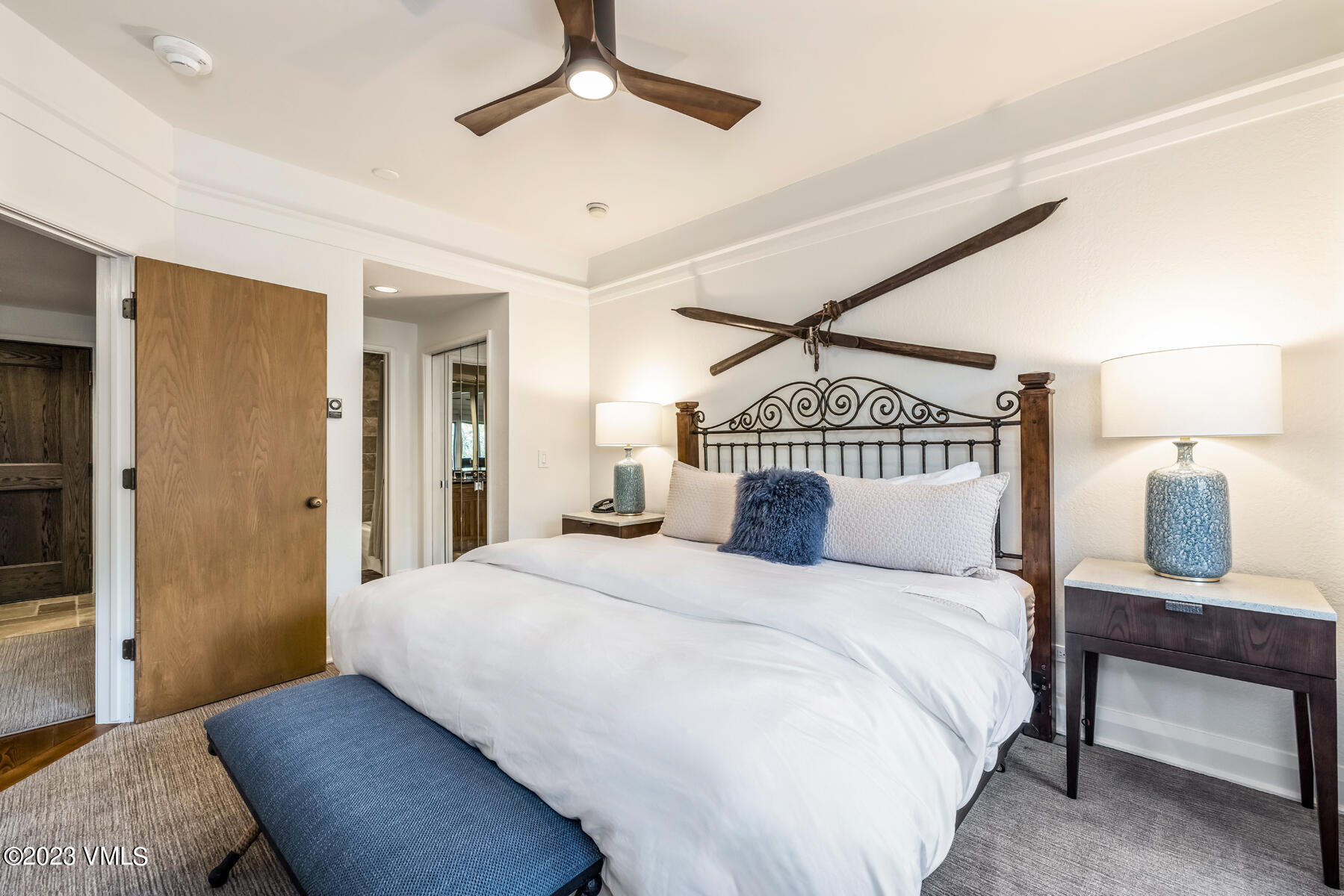 120 Offerson Road, Unit D260 Beaver Creek, CO 81620 - Photo 19 of 41 a bedroom with a bed and a chandelier