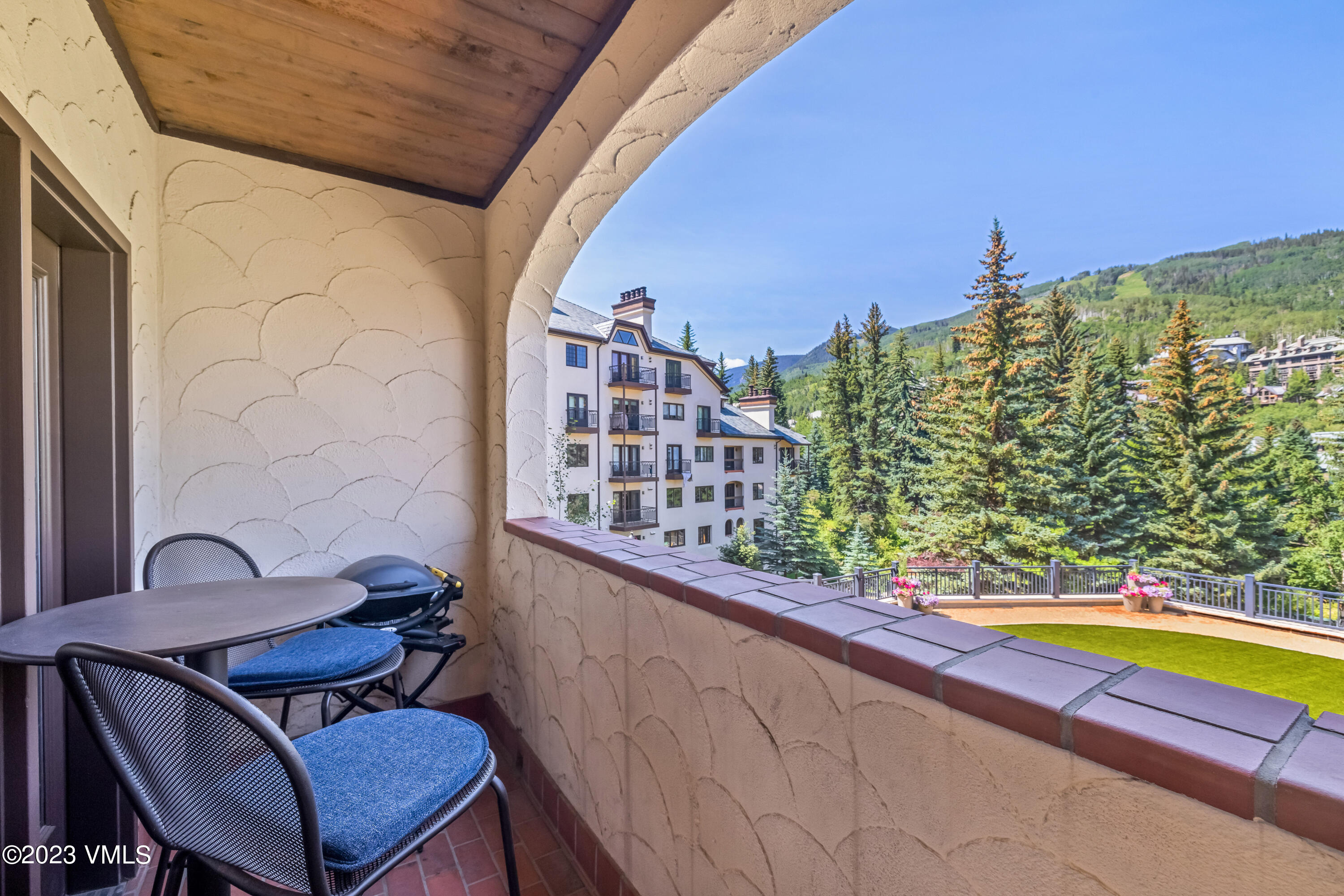 120 Offerson Road, Unit D260 Beaver Creek, CO 81620 - Photo 22 of 41 a view of a swimming pool with chairs