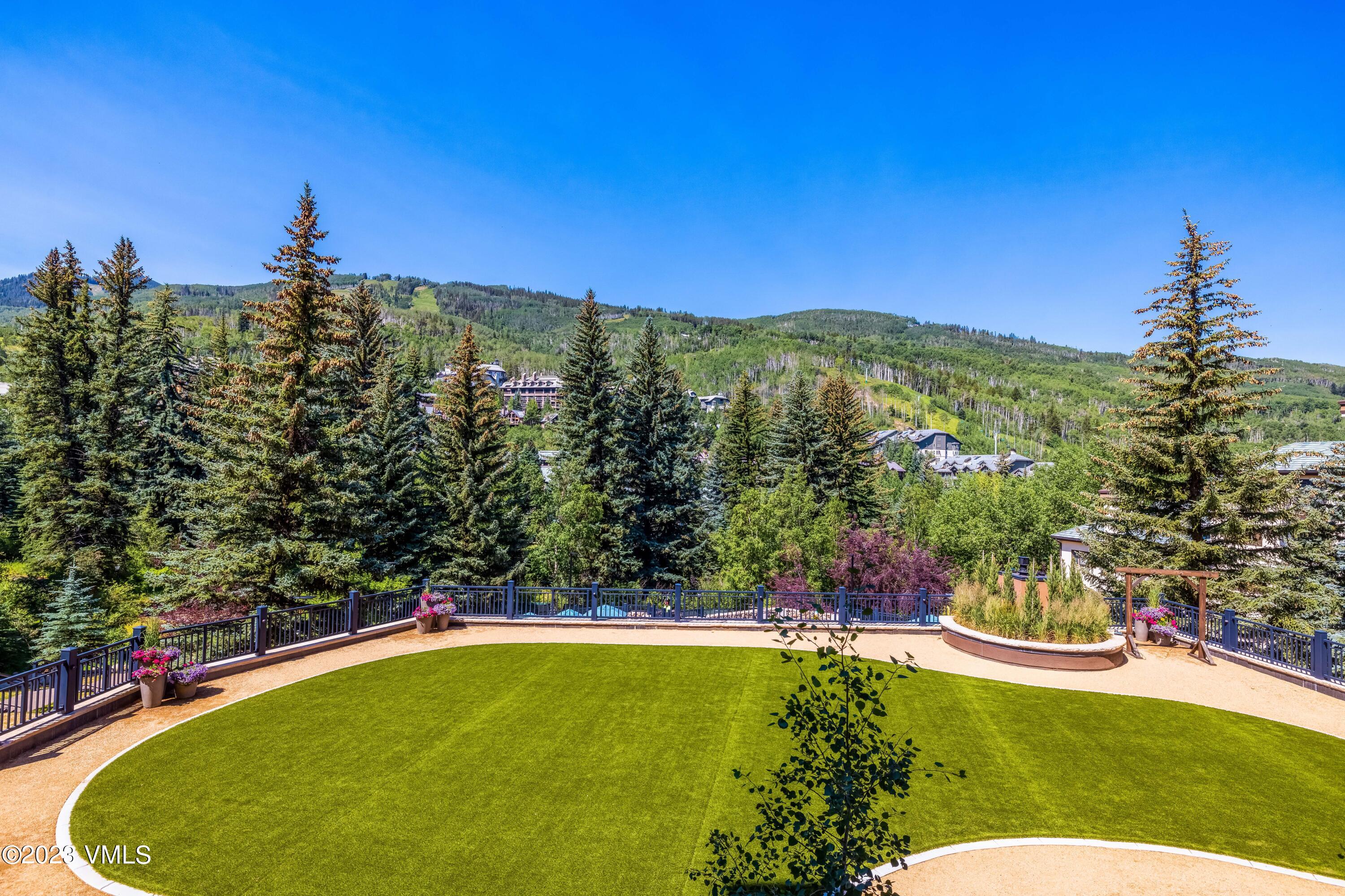 120 Offerson Road, Unit D260 Beaver Creek, CO 81620 - Photo 24 of 41 a view of a swimming pool with a yard and mountain view