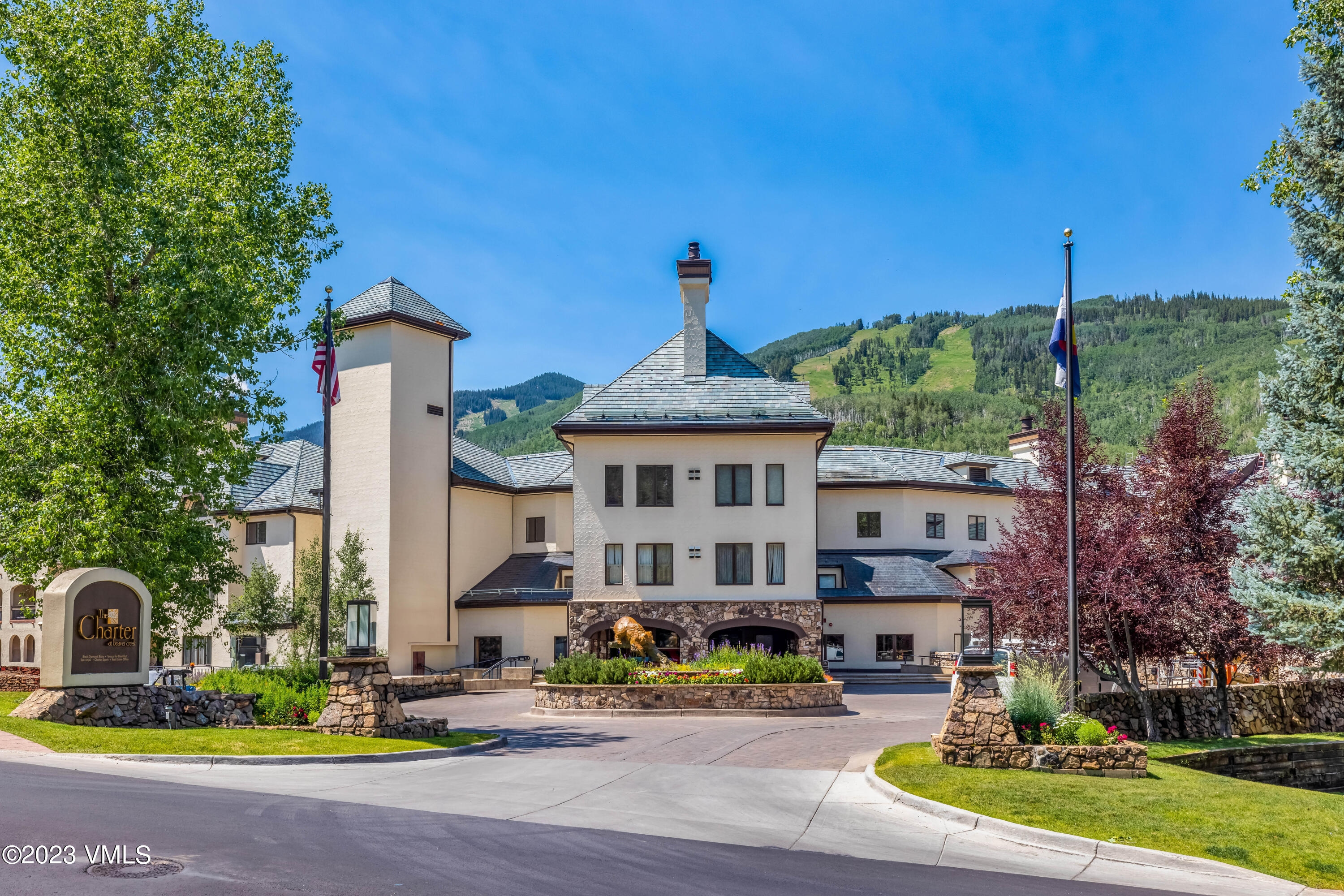 120 Offerson Road, Unit D260 Beaver Creek, CO 81620 - Photo 40 of 41 a front view of a house with a garden and plants