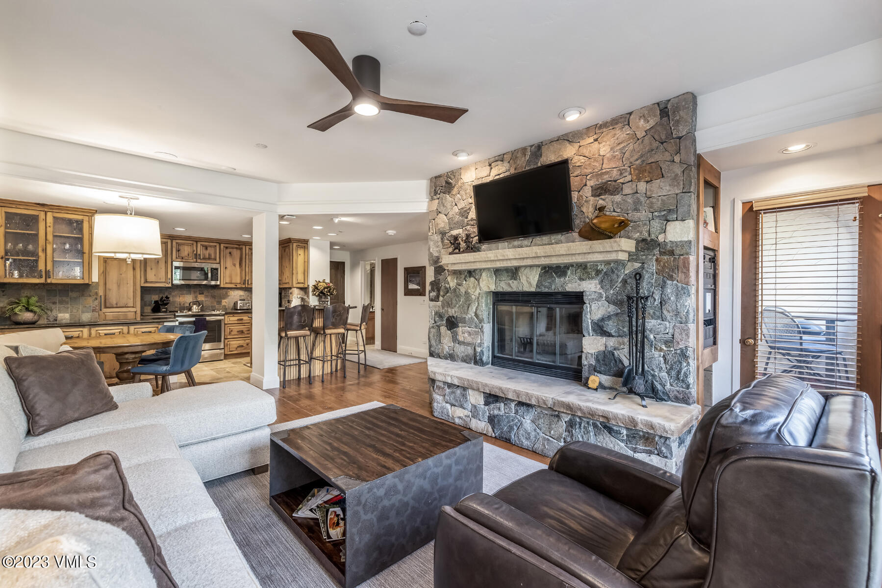 120 Offerson Road, Unit D260 Beaver Creek, CO 81620 - Photo 6 of 41 a living room with furniture a flat screen tv and a fireplace