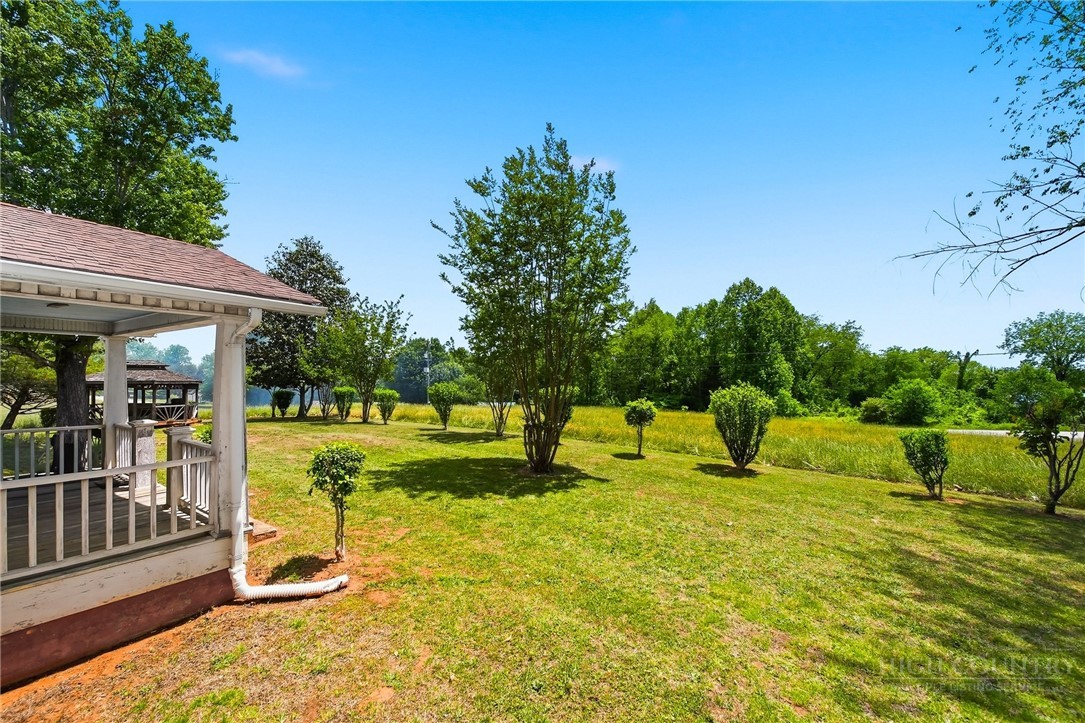 3450 Sparta Road North Wilkesboro, NC 28659 - Photo 19 of 34 a swimming pool with outdoor seating and yard