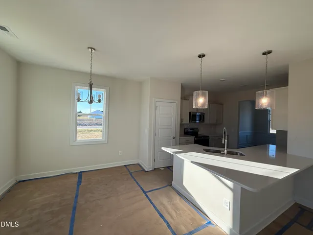 a kitchen with a sink and a stove
