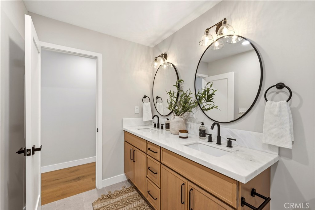 26418 Sand Canyon Road Canyon Country, CA 91387 - Photo 24 of 70 a bathroom with a sink and a mirror