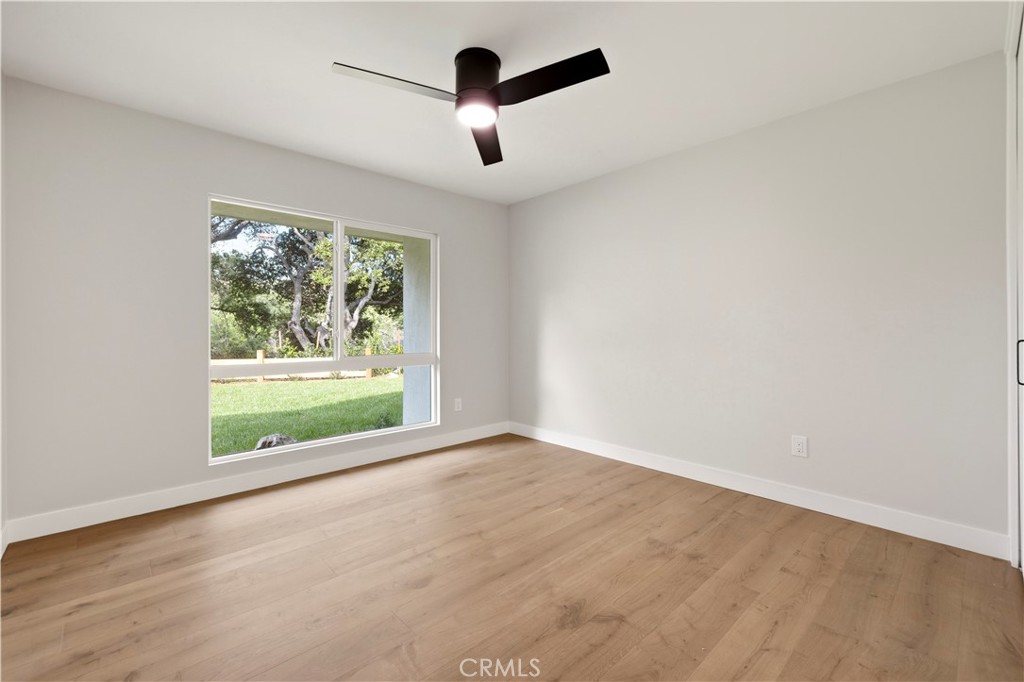 26418 Sand Canyon Road Canyon Country, CA 91387 - Photo 26 of 70 an empty room with ceiling fan and windows