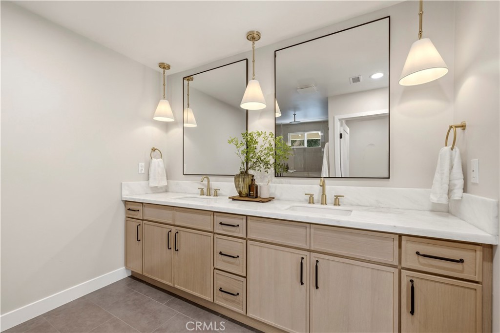 26418 Sand Canyon Road Canyon Country, CA 91387 - Photo 35 of 70 a bathroom with a double vanity sink and a mirror