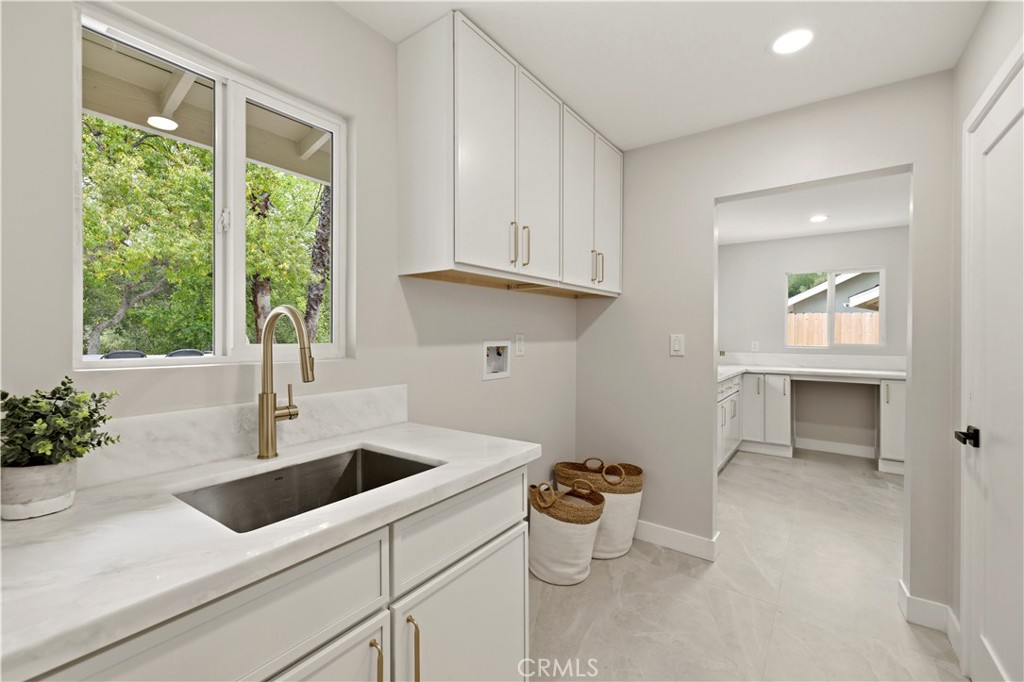 26418 Sand Canyon Road Canyon Country, CA 91387 - Photo 42 of 70 a kitchen that has a sink and a window