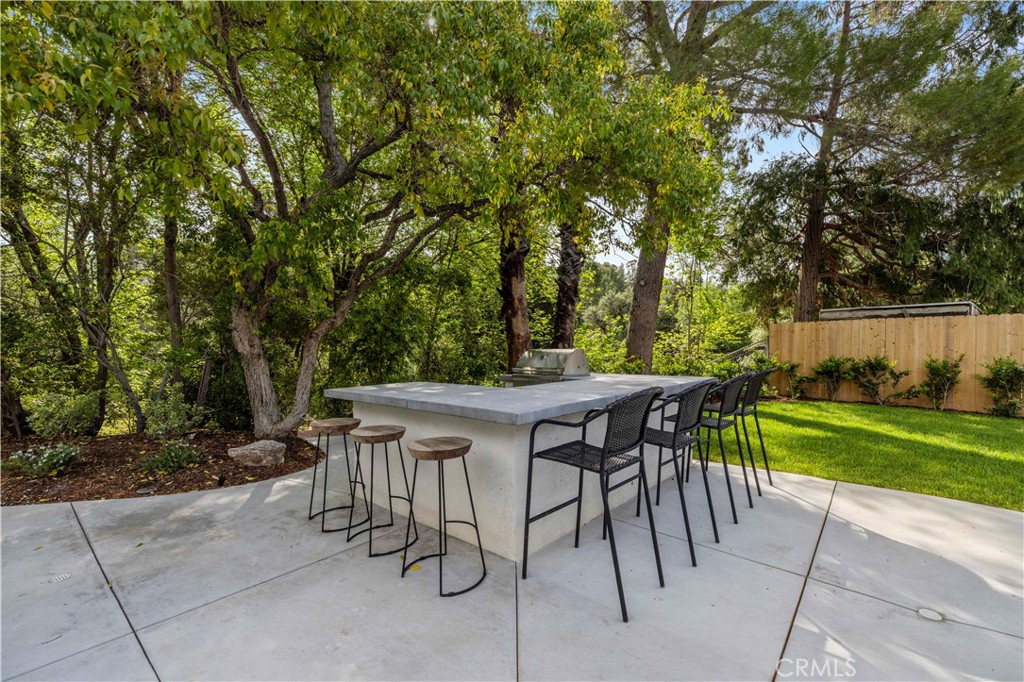 26418 Sand Canyon Road Canyon Country, CA 91387 - Photo 46 of 70 a view of an outdoor sitting area with brick wall