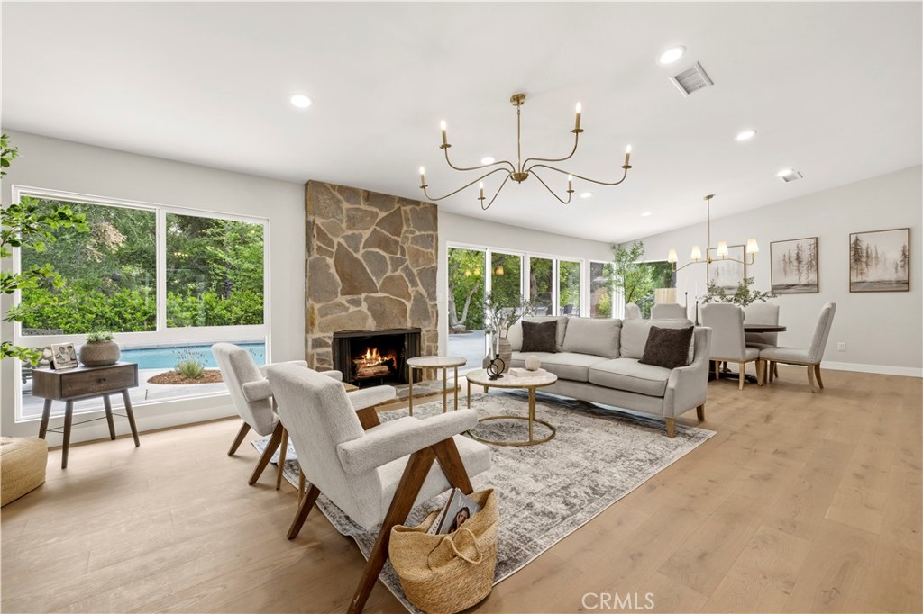 26418 Sand Canyon Road Canyon Country, CA 91387 - Photo 7 of 70 a living room with furniture a fireplace and a large window
