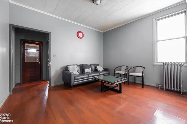 a view of a house with a door and wooden walls