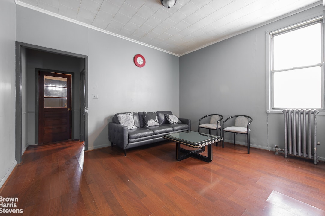18-01 26th Road Queens, NY 11102 - Photo 2 of 16 a living room with furniture and a window