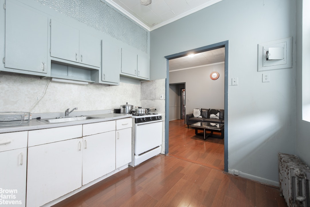 18-01 26th Road Queens, NY 11102 - Photo 3 of 16 a kitchen with sink cabinets and appliances