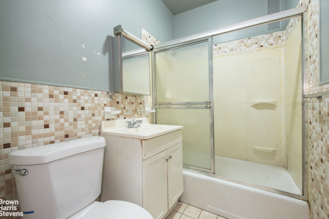 18-01 26th Road Queens, NY 11102 - Photo 5 of 16 a bathroom with a sink toilet and shower