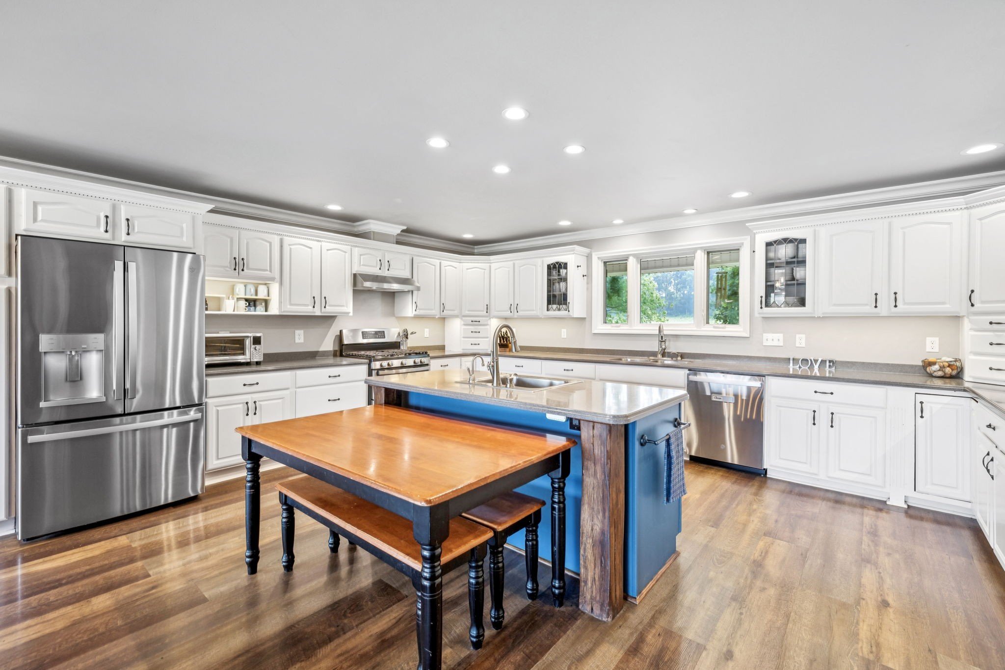2797 Lewis Road Santa Fe, TN 38482 - Photo 15 of 92 a kitchen with kitchen island granite countertop wooden floors and stainless steel appliances