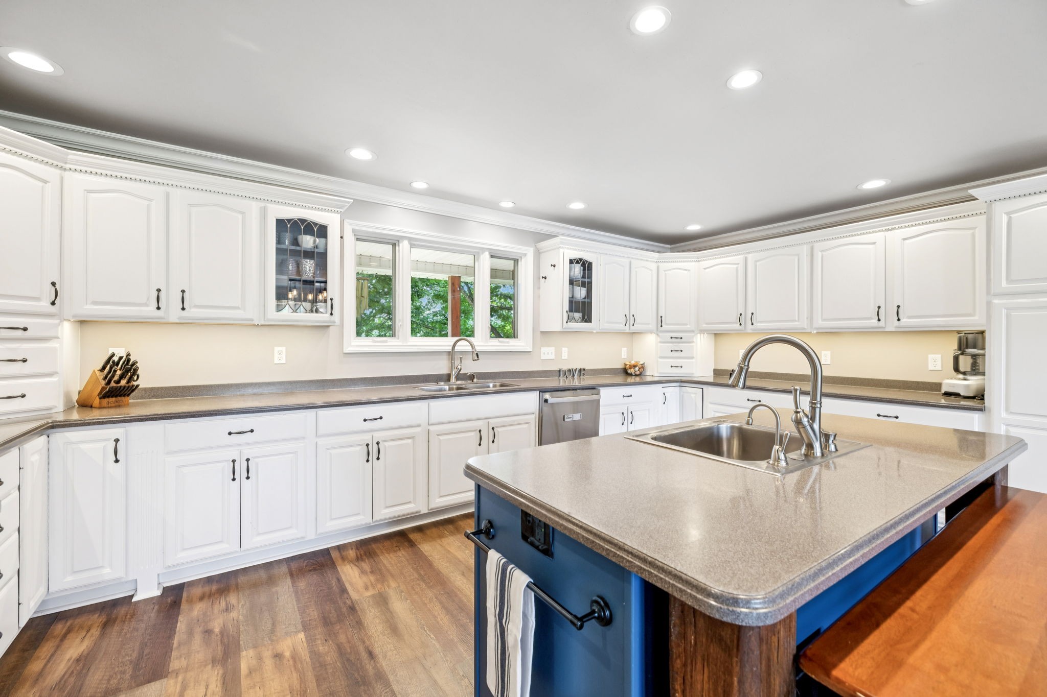 2797 Lewis Road Santa Fe, TN 38482 - Photo 21 of 92 a kitchen with granite countertop a sink and white cabinets