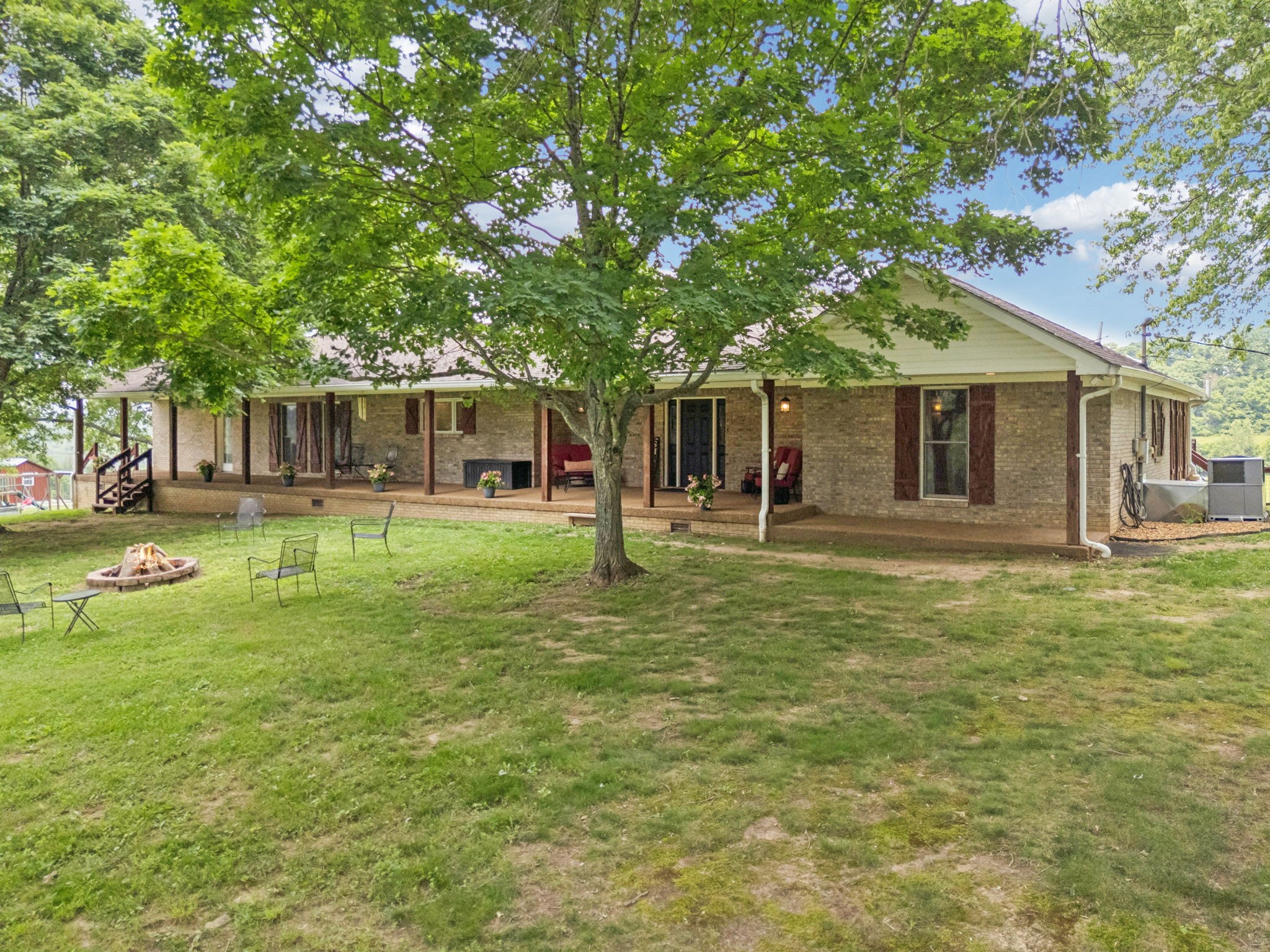 2797 Lewis Road Santa Fe, TN 38482 - Photo 3 of 92 a backyard of a house with table and chairs