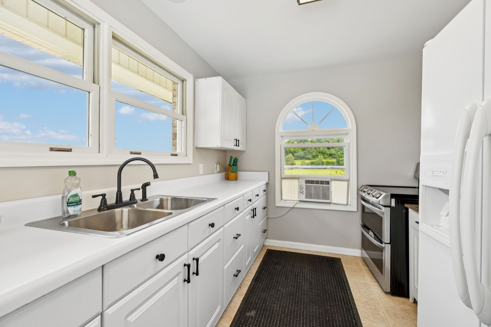 2797 Lewis Road Santa Fe, TN 38482 - Photo 48 of 92 a kitchen with granite countertop a window a sink stainless steel appliances and a window