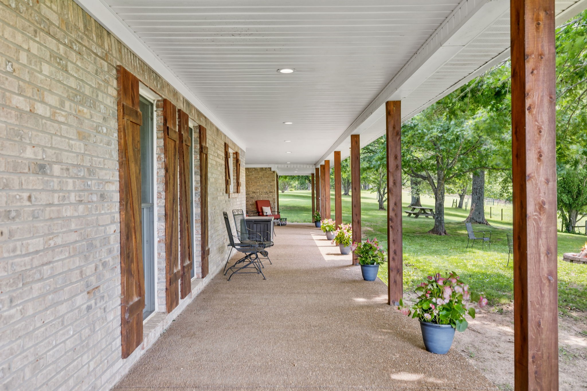 2797 Lewis Road Santa Fe, TN 38482 - Photo 6 of 92 a view of a porch with chairs and backyard