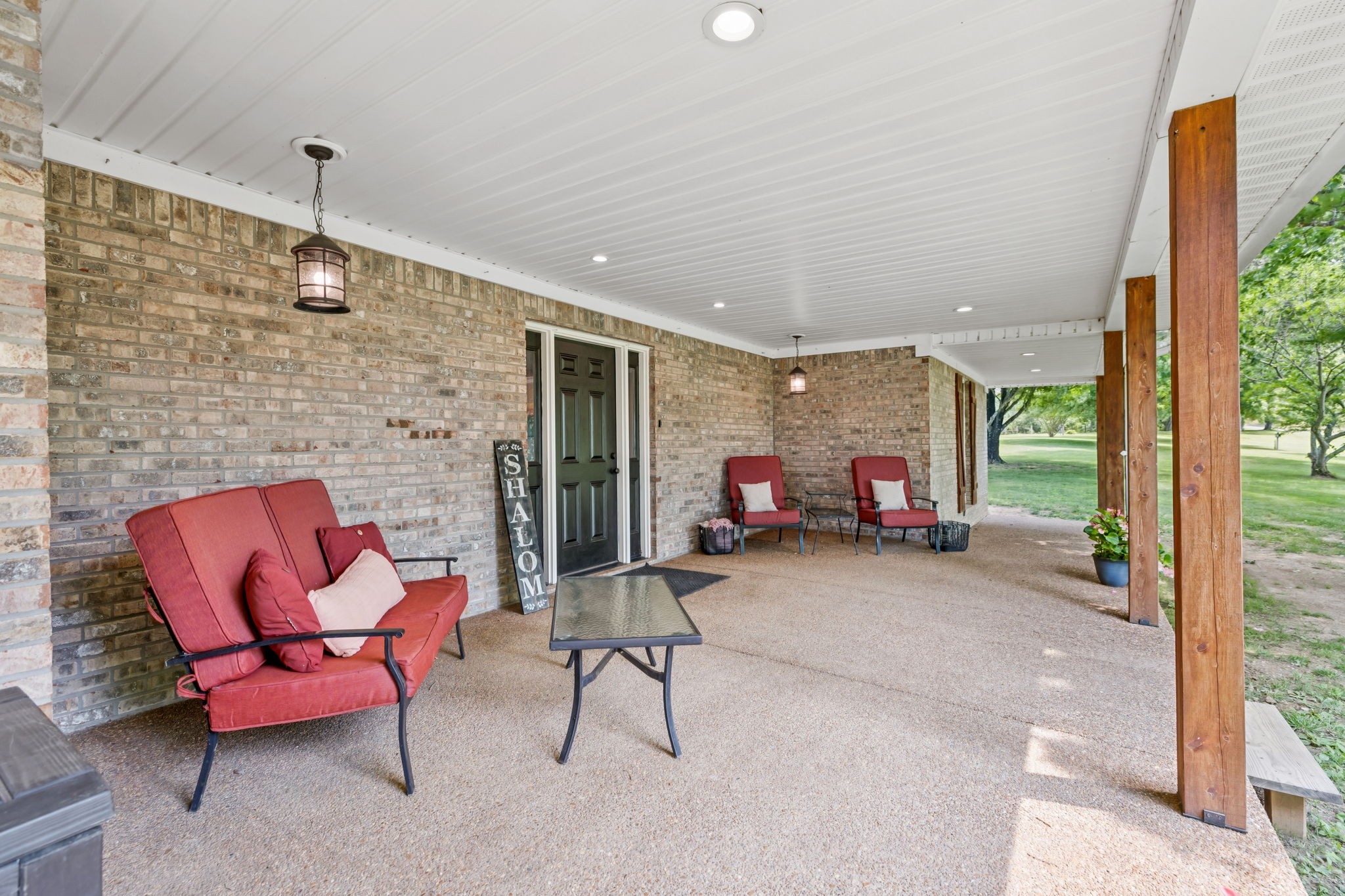 2797 Lewis Road Santa Fe, TN 38482 - Photo 64 of 92 a living room with furniture a fireplace and a large window