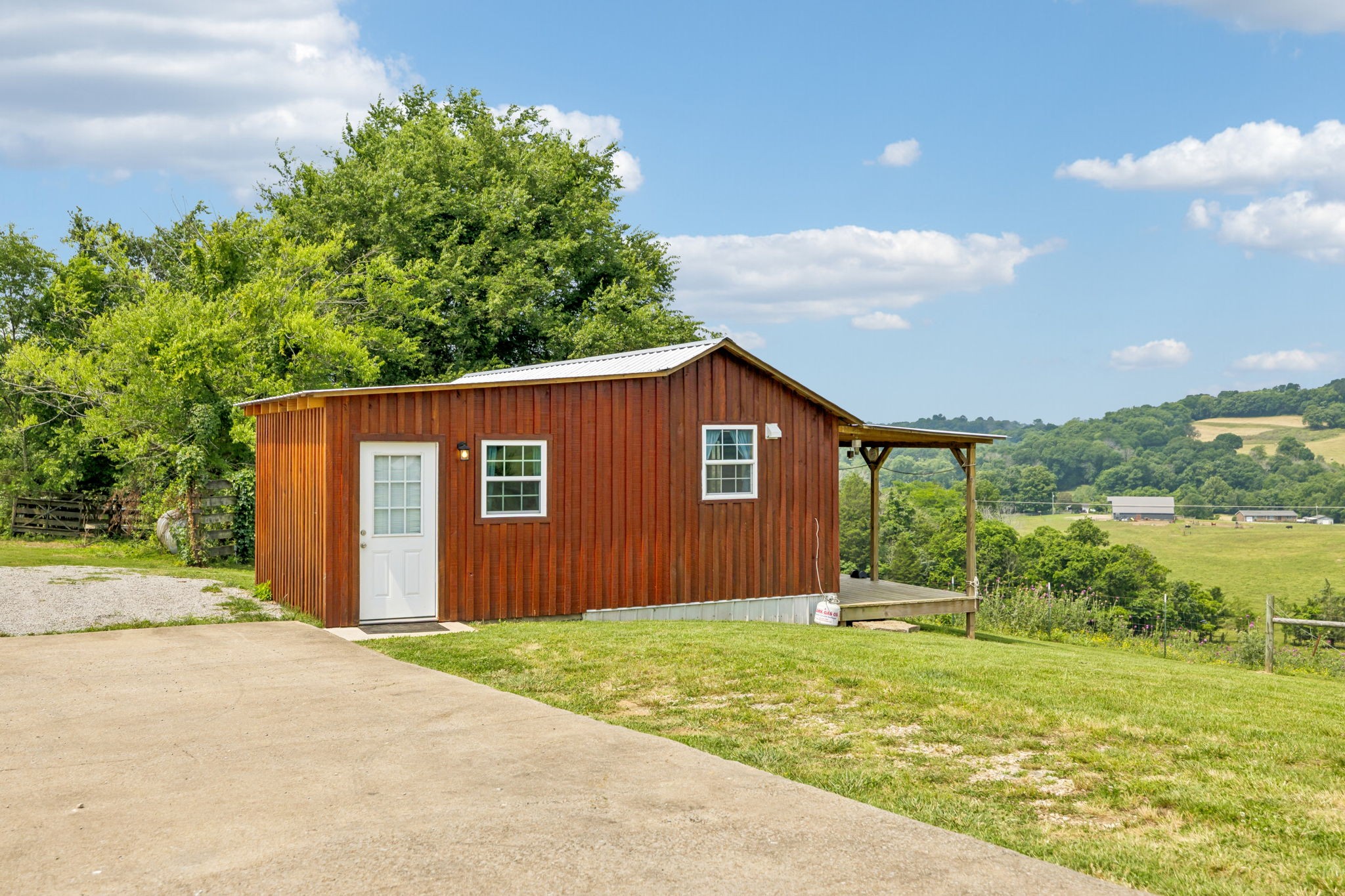 2797 Lewis Road Santa Fe, TN 38482 - Photo 88 of 92 a backyard of a house with lots of green space and garden