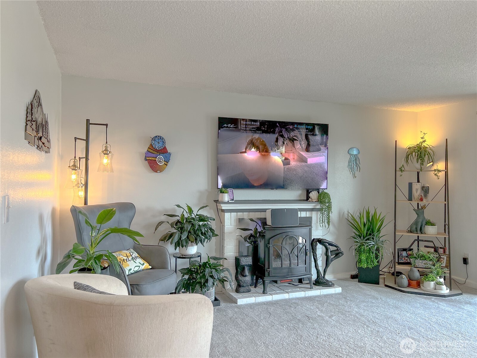 3390 Narrows Lane Northeast, Unit 101 Bremerton, WA 98310 - Photo 12 of 29 a living room with furniture and a flat screen tv