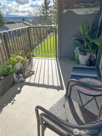 a view of balcony with furniture