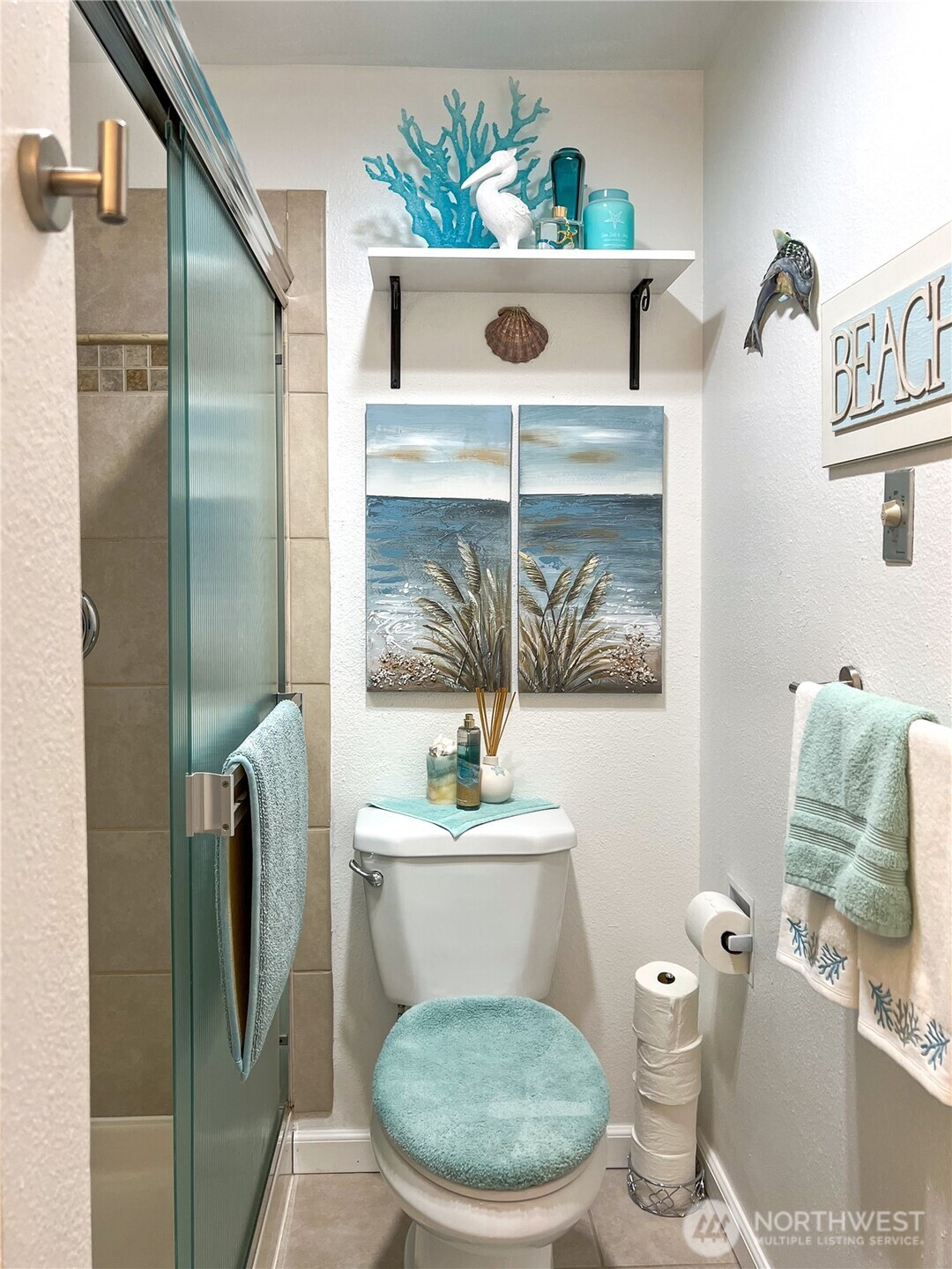 3390 Narrows Lane Northeast, Unit 101 Bremerton, WA 98310 - Photo 17 of 29 a bathroom with a toilet a sink and mirror