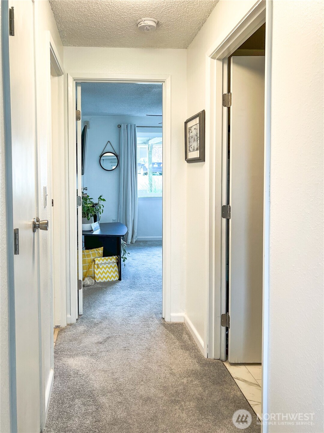 3390 Narrows Lane Northeast, Unit 101 Bremerton, WA 98310 - Photo 19 of 29 a view of a livingroom with a couch and door