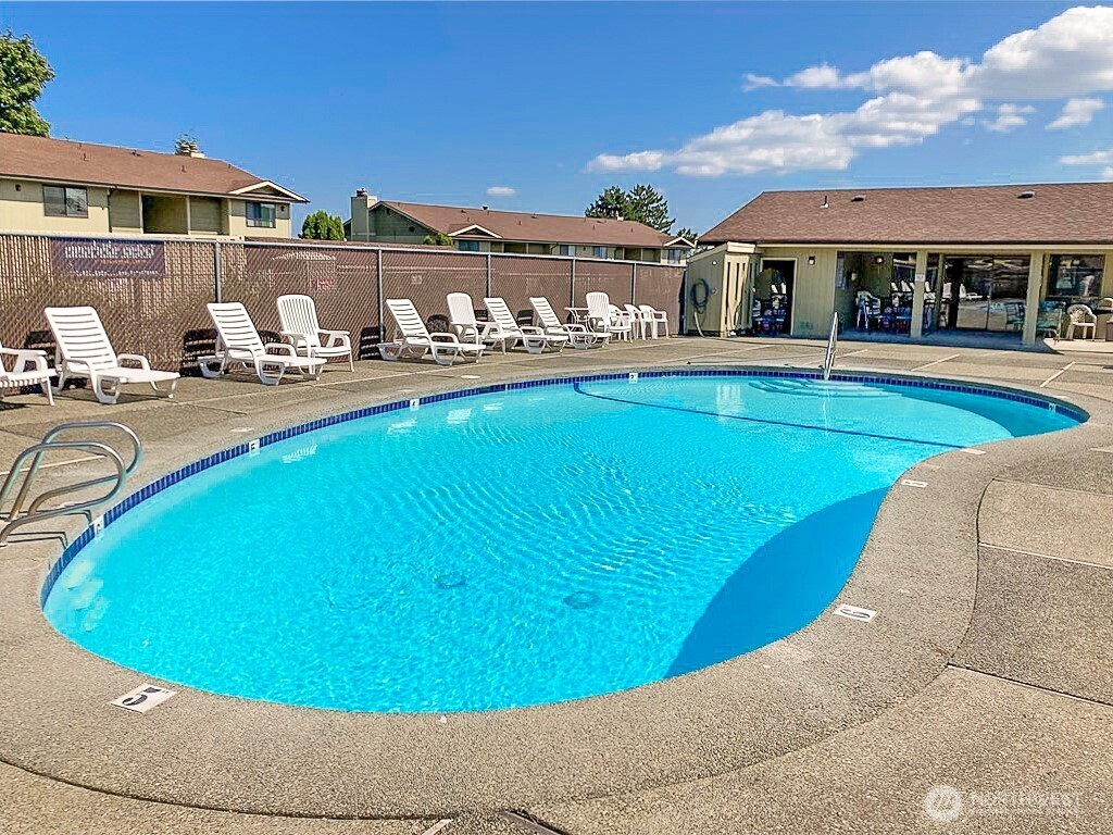 3390 Narrows Lane Northeast, Unit 101 Bremerton, WA 98310 - Photo 23 of 29 a view of a house with a swimming pool