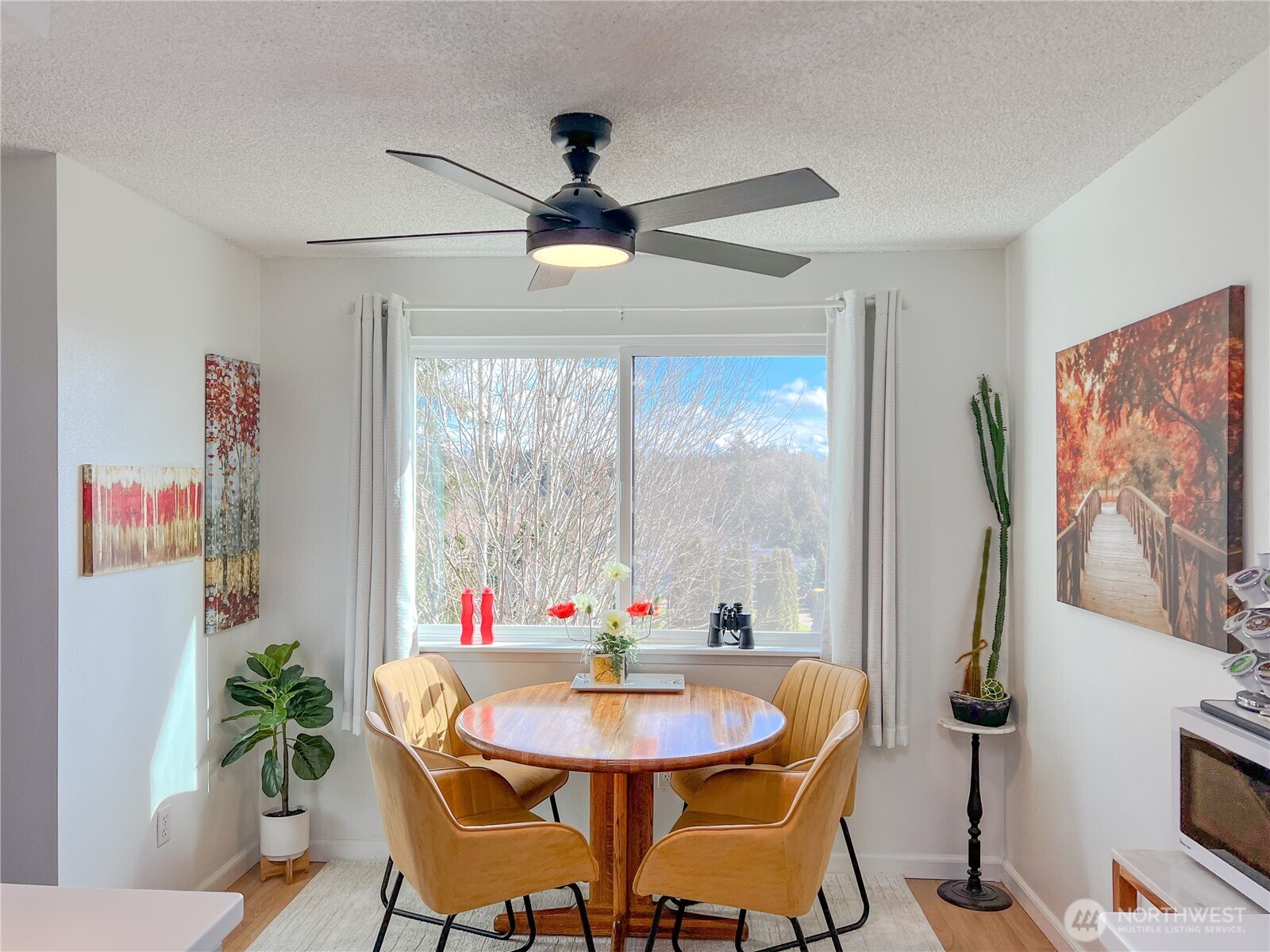 3390 Narrows Lane Northeast, Unit 101 Bremerton, WA 98310 - Photo 7 of 29 a view of a dining room with furniture window and outside view