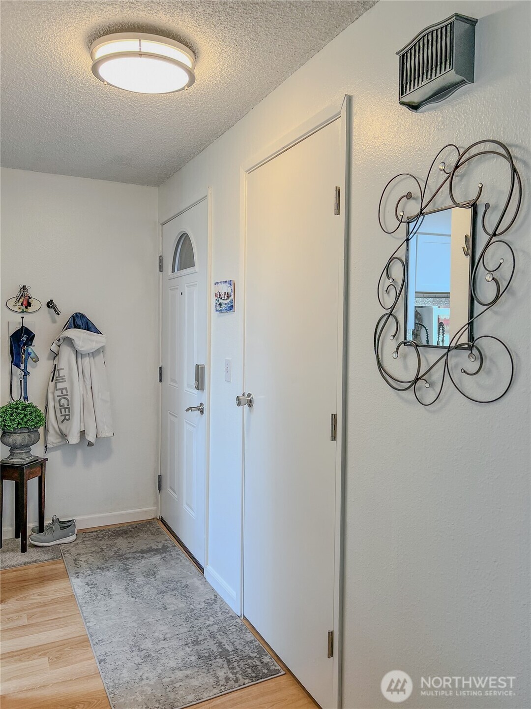 3390 Narrows Lane Northeast, Unit 101 Bremerton, WA 98310 - Photo 10 of 29 a view of an entryway with wooden floor